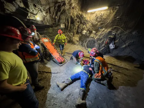 Stephen Kenny captured this photo of a ERT training session inside the 800 Level of SURF - this image shows technicians around a person who is pretending to be injured in an underground space. 