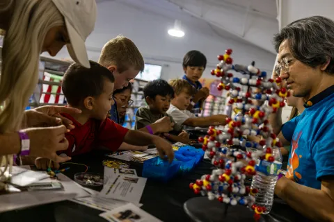 Children engaged in hands-on science learning at Neutrino Day 2025