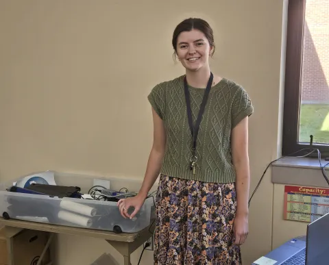 Emily Siemonsma in a classroom with scientific equipment 