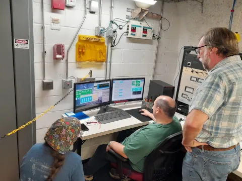 First beam team monitors progress inside the control room at CASPAR. 