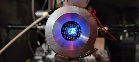 A proton beam on a quartz window target inside CASPAR. 