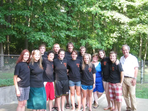 A group photo of the 2010 Davis-Bahcall cohort at a swimming pool. 