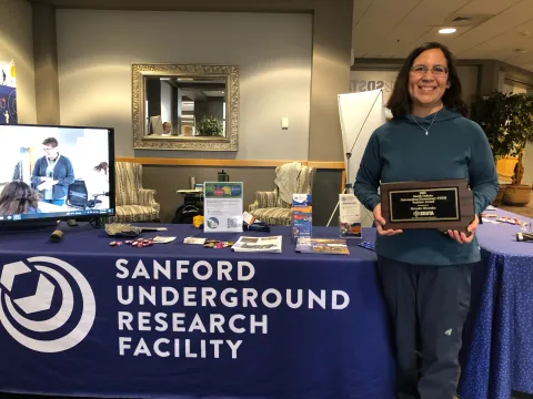 Brenda Mizenko of St. Elizabeth Seton Elementary School in Rapid City holding her award at the SURF booth for the 2026 STEM Ed Conference 