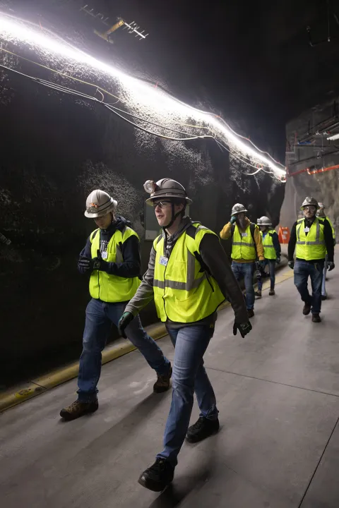 Students walking down a drift at SURF. 