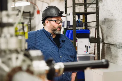 Mark Hanhardt stands inside CASPAR 