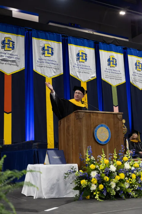Mike headley speaking at the 2026 SDSU commencement