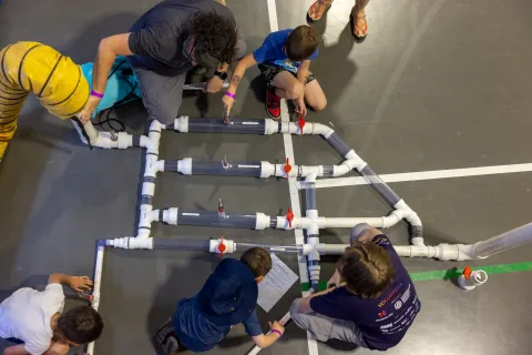 Kids work on a hands-on science demonstration at Neutrino Day