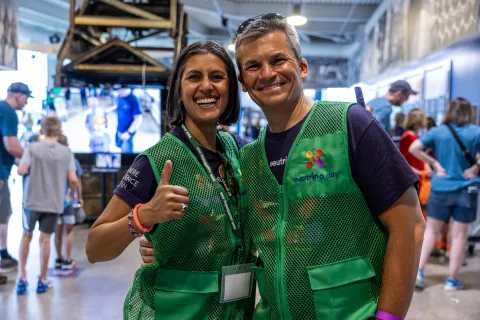SURF Volunteers are the heart of Neutrino Day they pose here in green jackets 