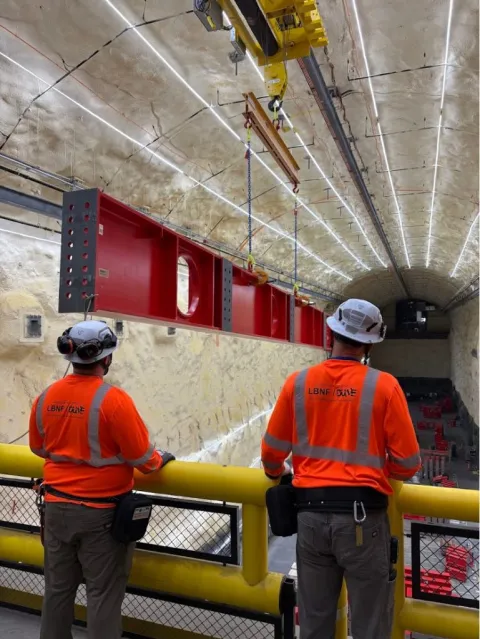 A massive steel beam for DUNE is delivered to the south cavern, nearly a mile below the surface at the Sanford Underground Research Facility in Lead, South Dakota. 