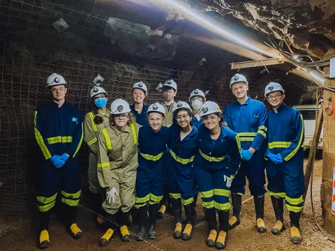 a group of students in an underground drift 