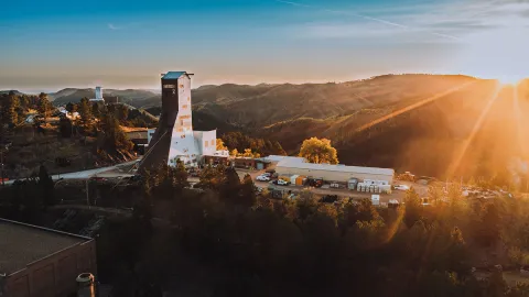 drone shot shows a sunburst over the SURF facility 