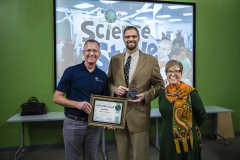 Mike Headley and Constance Walter present the CORES Award to "Science" Steve Rocusek in 2019.