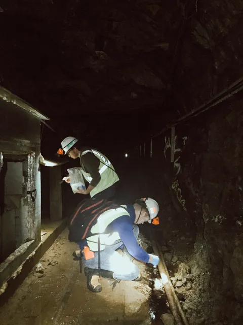 Two students look for samples on the 300 Level