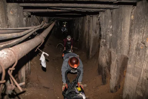 ERT members crawl through a short drift.