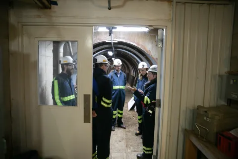 people standing in a tunnel
