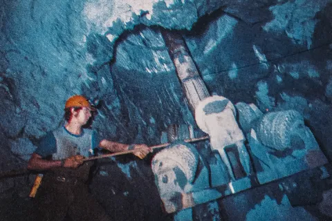 Tom REgan operates a borehole machine. Photo from the Homestake Centennial booklet, published 1976.