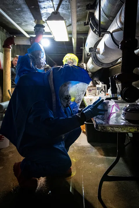 Sgt. Travis Johnson, left, and Sgt. Domonic Delaney, both of the 81st Civil Support Team, assisted by the Rapid City Fire Department Hazardous Materials (HAZMAT) team, take samples of biological agents during a chemical and biological weapons response exercise at the Sanford Underground Research Facility (SURF) in Lead, South Dakota, April 26, 2022.