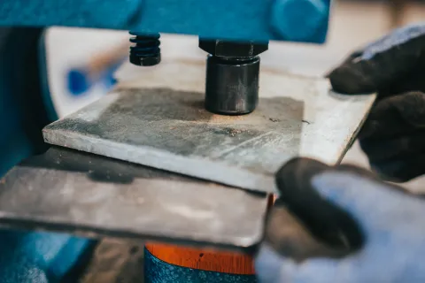 a facilities technician at SURF operates an ironworker