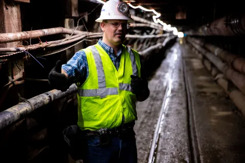 Man stands in underground tunnel