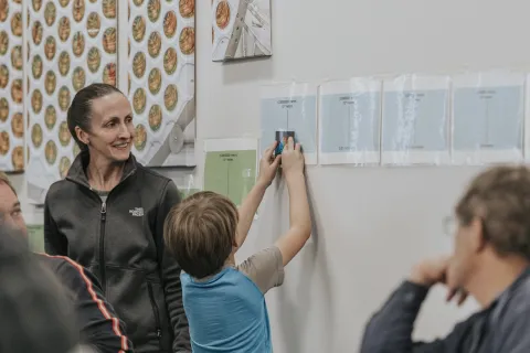 Instructor interacts with student at Deep Talks event