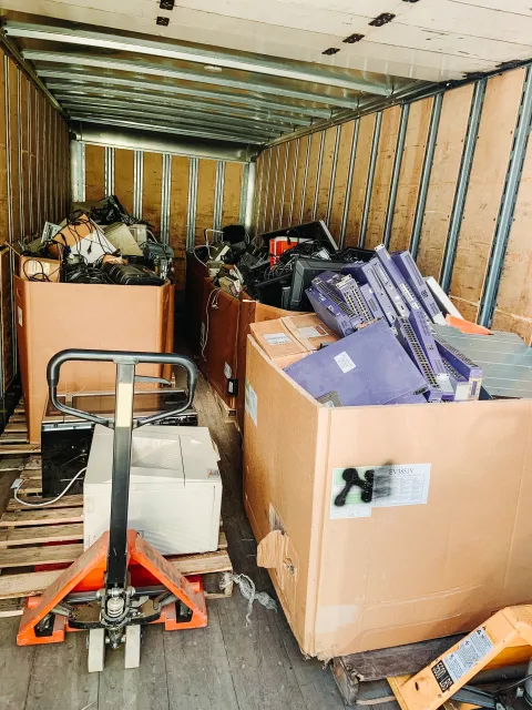 a loading truck full of recyclable electronics