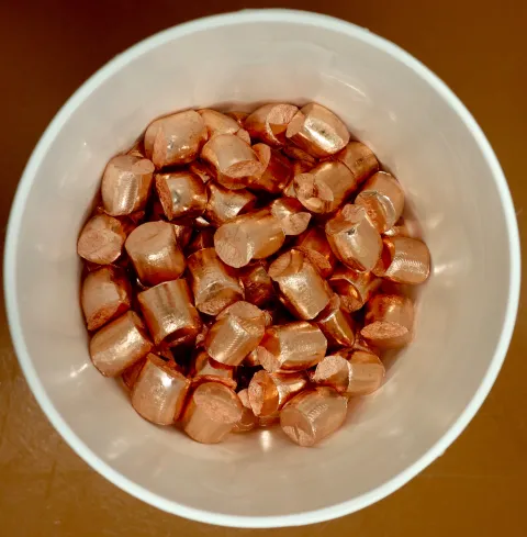 Copper nuggets before being placed in electroforming baths. These have already been triple-etched in nitric acid.