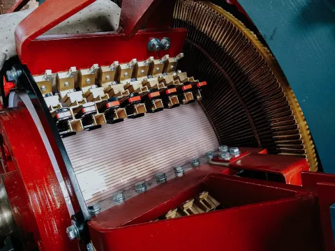 A closeup view of the commutator brushes, commutator, and armature windings on the DC generator