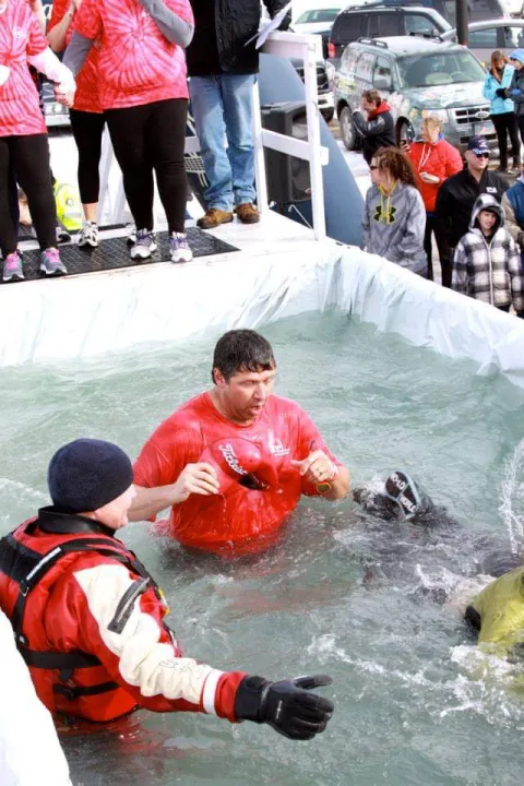 Leatherman jumps into pool of water for Polar Plunge