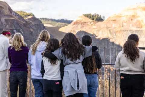 Students looking out over the Open Cut in Lead during a lesson on the local geology of the area. Photo by Stephen Kenny