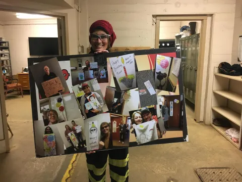 Varland holds a collage picturing her previous designs and their recipients.