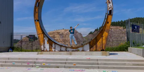 A person stands inside the Davis Ring during Neutrino Day 2025 