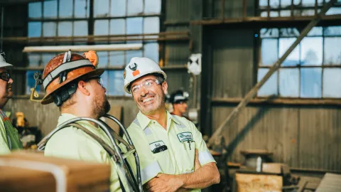 Two employees enjoy their work.