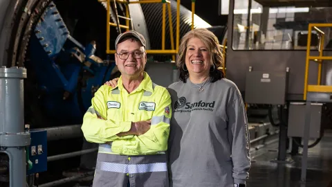 Donald Daywitt stands next to Wendy Straub at the Ross Hoist