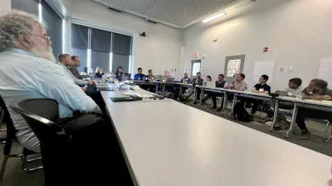 Participants around a table at the Quantum Research Collaboration Workshop at SURF 