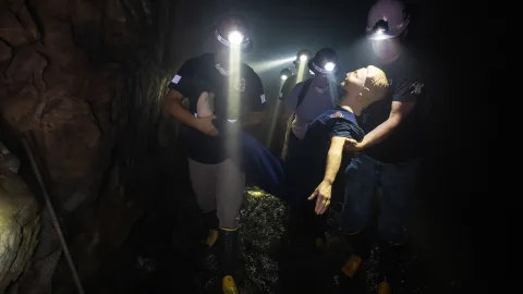 Students in a mock emergency evacuate from the underground during the mine rescue competition at SURF. 