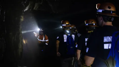 Students learn underground in the darkness with headlamps during the 2024 Mine Rescue Competition 