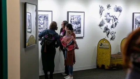 People view art at the artist reception in the Ruddell Gallery