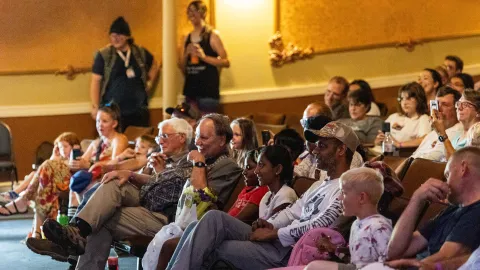 The crowd enjoying a presentation in the Homestake Opera House  
