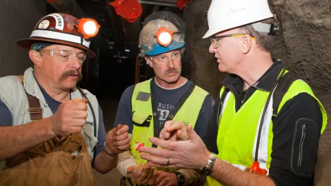 Kip Johnson (center) speaks with Mike Headley and Jack Stratton undergroudn at SURF.