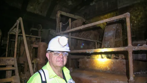 Dan Regan inside the historic 4 Winze Hoistroom at SURF. 