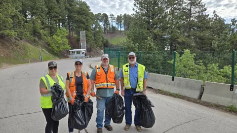 Volunteers with a nice haul of trash in bags on Clean Up Day in the neighborhood just outside the main Yates gate at SURF. 