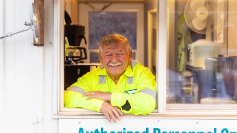Ricky Allen smiles from the widow of the Yates Guard House 