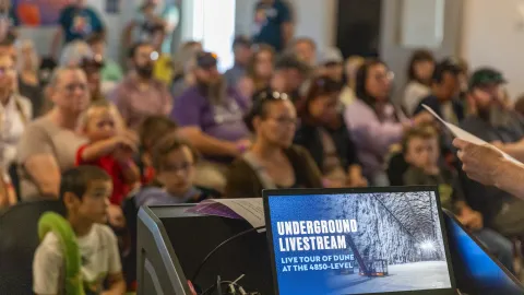 A full house is gathered inside the classroom at the Sanford Lab Homestake Visitor Center for the Neutrino Day 2025 livestream from the underground. 