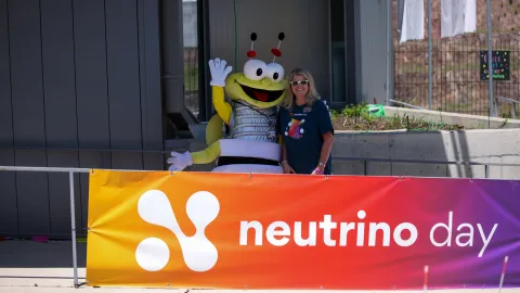 BHE Bee mascot and Michelle Kane