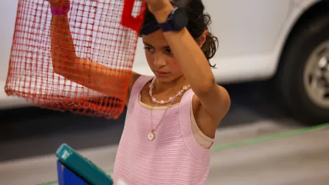 A kid with a hands-on science experiment