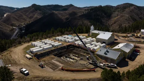 A drone shot over a crane operating at the Waste Water Treatment Plant