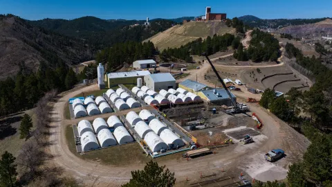 A drone shot over a crane operating at the Waste Water Treatment Plant