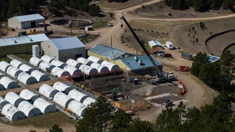 A drone shot over a crane operating at the Waste Water Treatment Plant