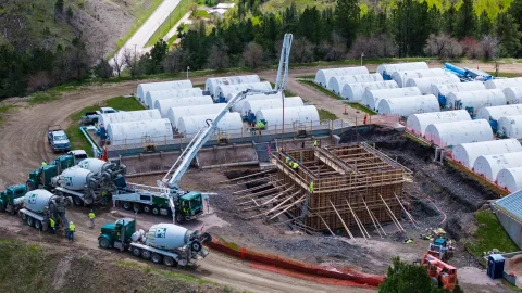 Workers completing the concrete pour into forms at SURF.
