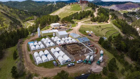 Workers completing the concrete pour into forms at SURF.